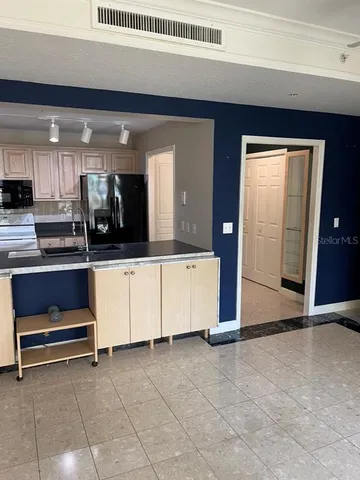 a view of living room with furniture and window