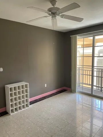 a view of an empty room with a window