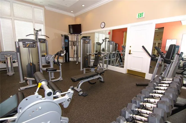 a very nice looking room with a large window and a flat screen tv