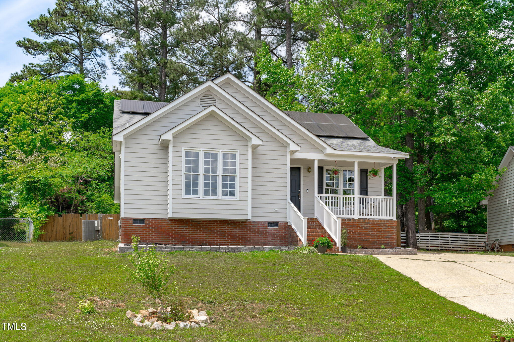Undisclosed Address Garner, NC 27529 - Photo 1 of 31 a front view of a house with a yard