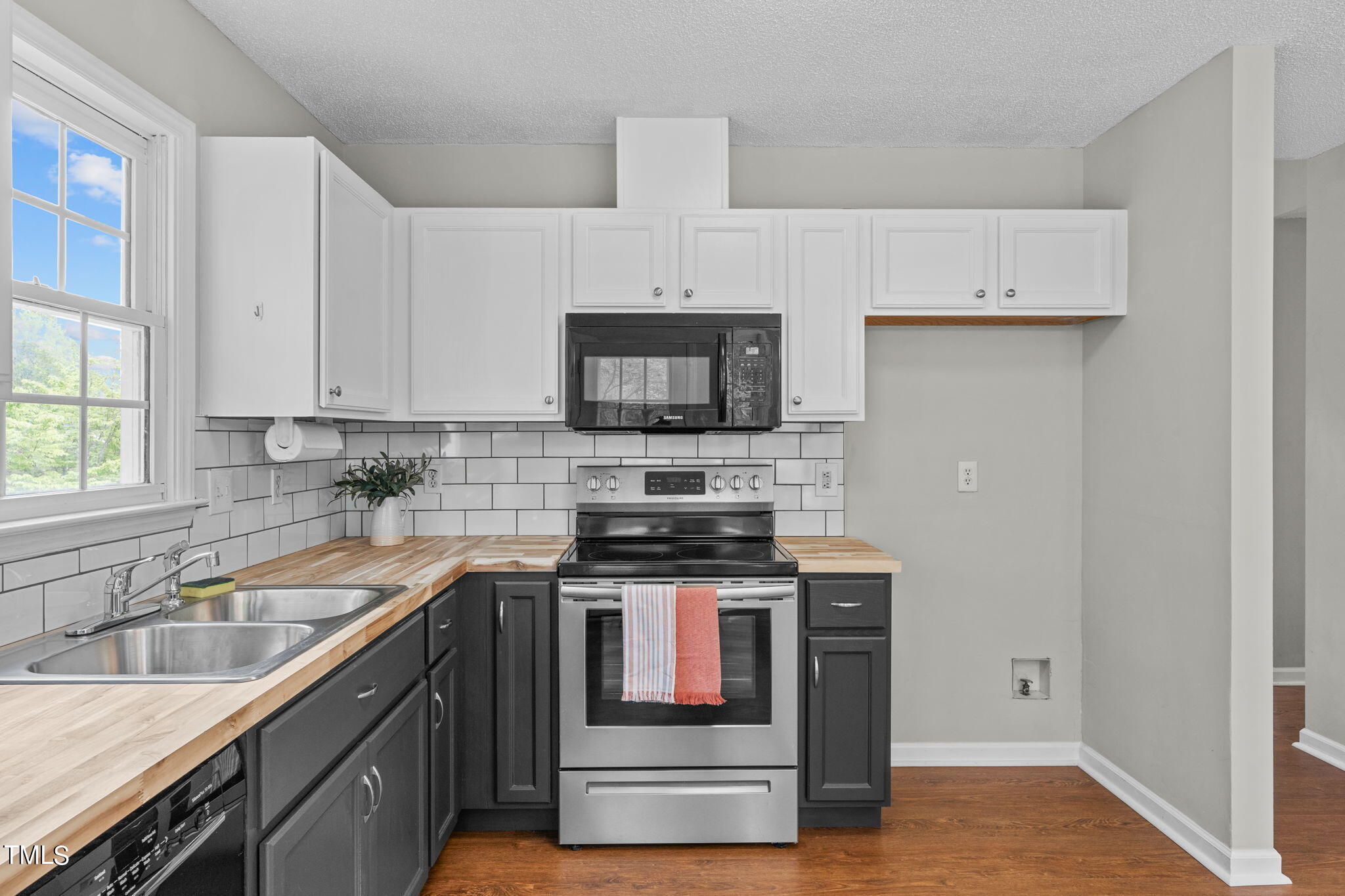 Undisclosed Address Garner, NC 27529 - Photo 11 of 31 a kitchen with stainless steel appliances granite countertop a stove and a sink