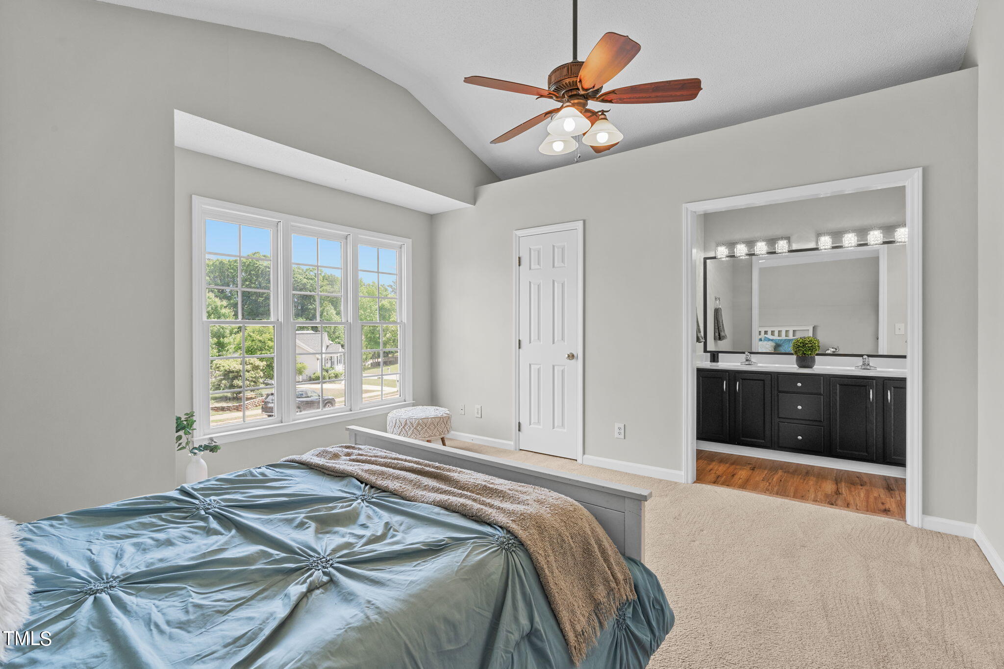 Undisclosed Address Garner, NC 27529 - Photo 15 of 31 a bedroom with a bed and a chandelier