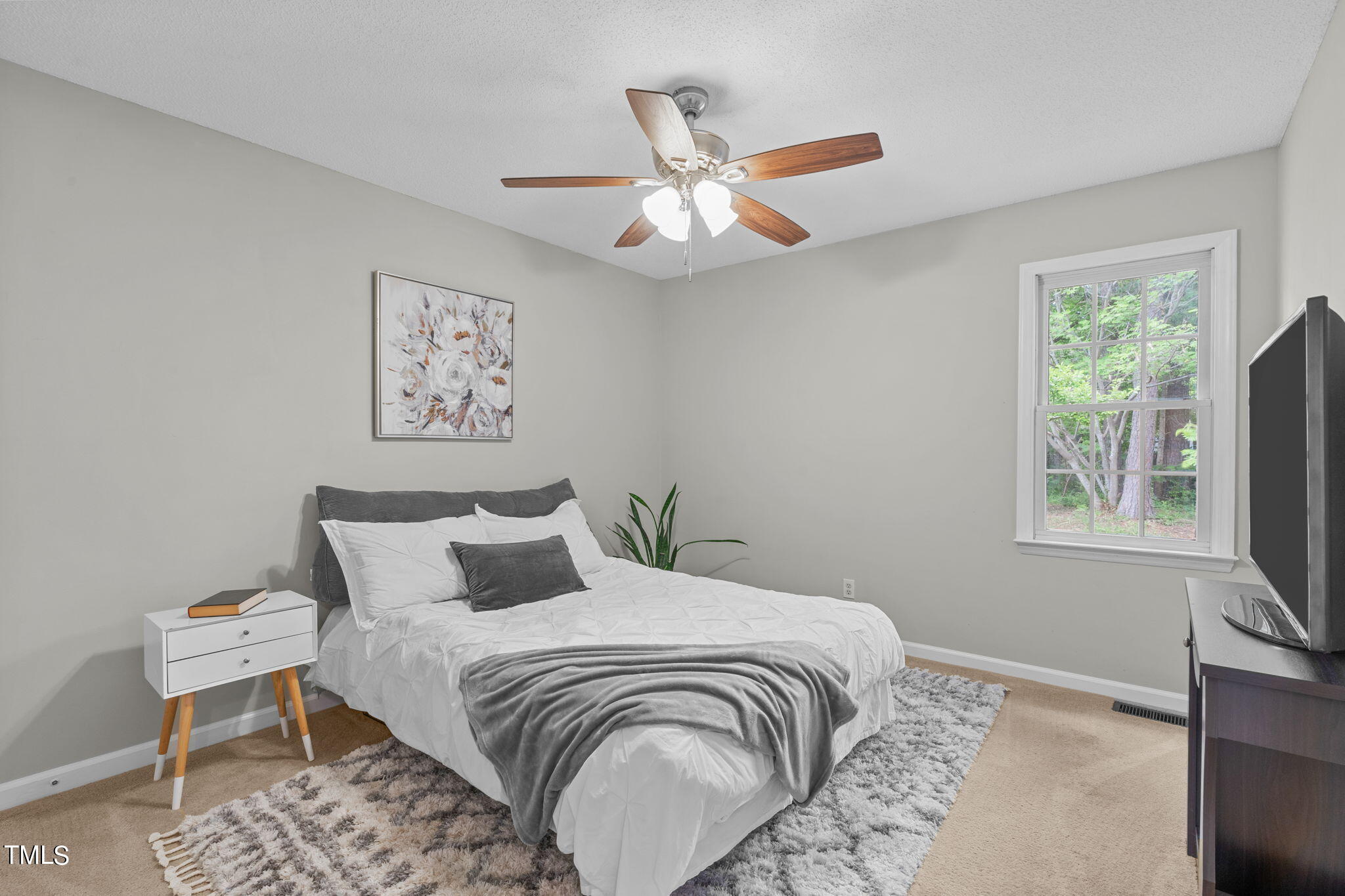 Undisclosed Address Garner, NC 27529 - Photo 21 of 31 a bedroom with a bed and a window