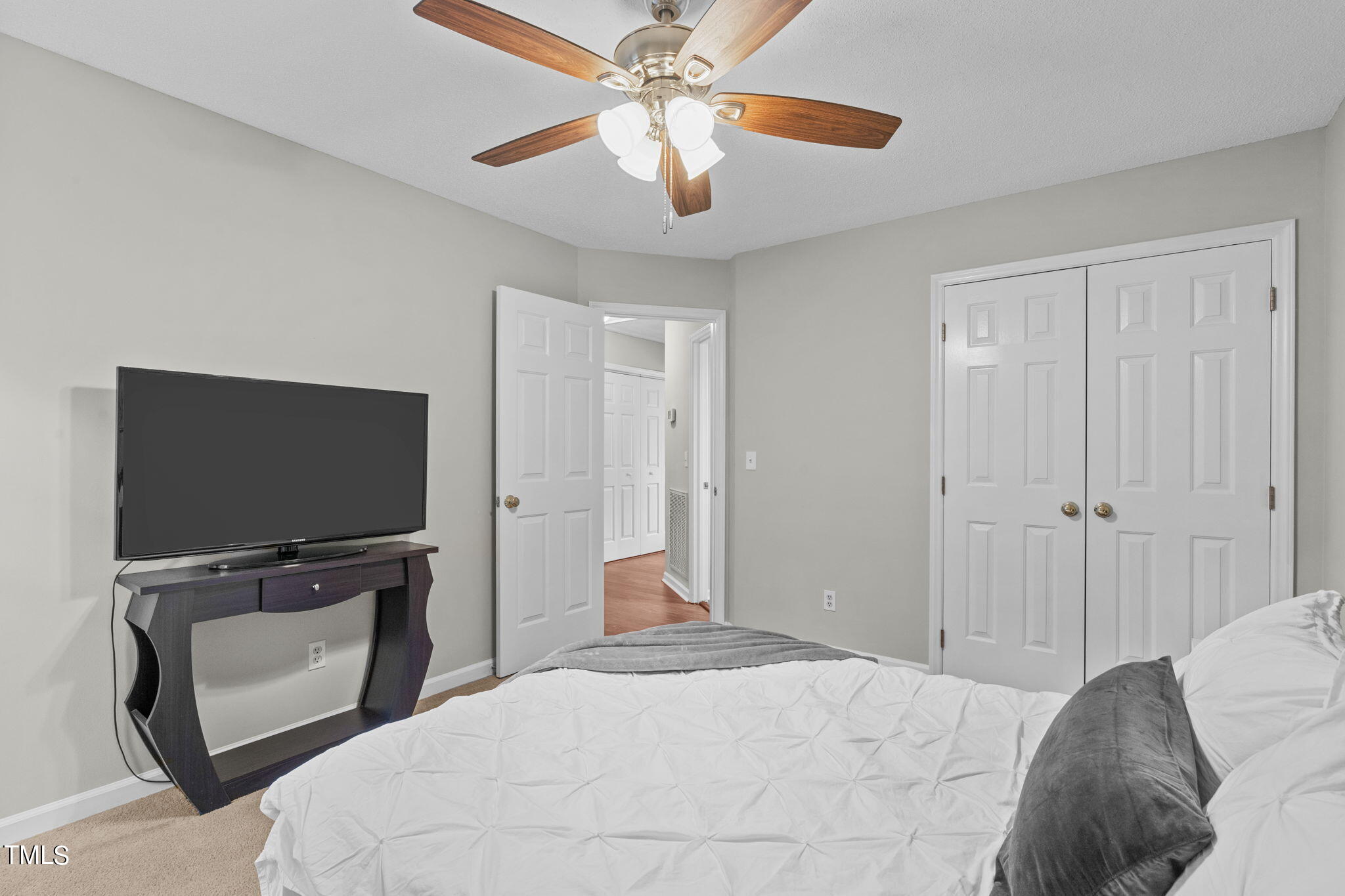 Undisclosed Address Garner, NC 27529 - Photo 22 of 31 a bedroom with a bed and a flat screen tv