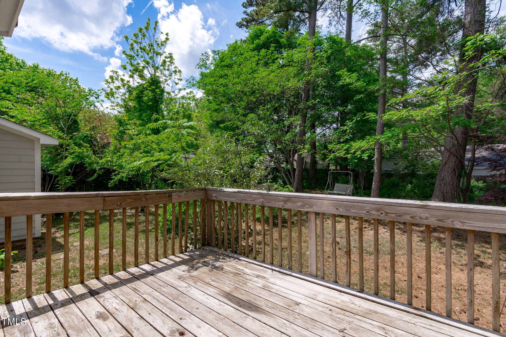 Undisclosed Address Garner, NC 27529 - Photo 27 of 31 a balcony with wooden floor and fence