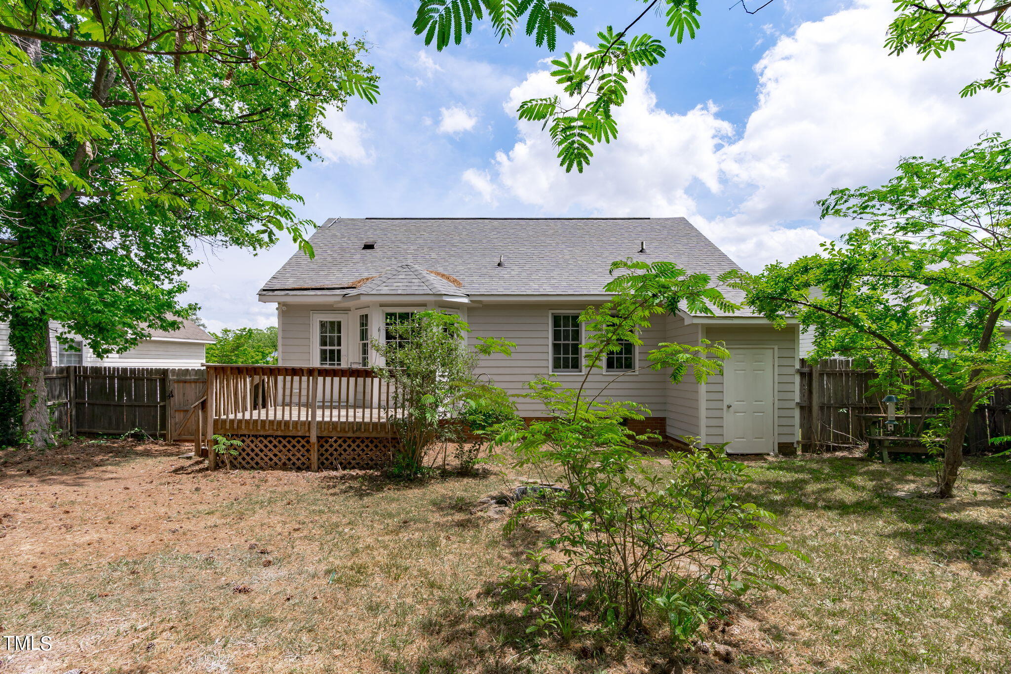 Undisclosed Address Garner, NC 27529 - Photo 28 of 31 a view of a house with a yard and plants