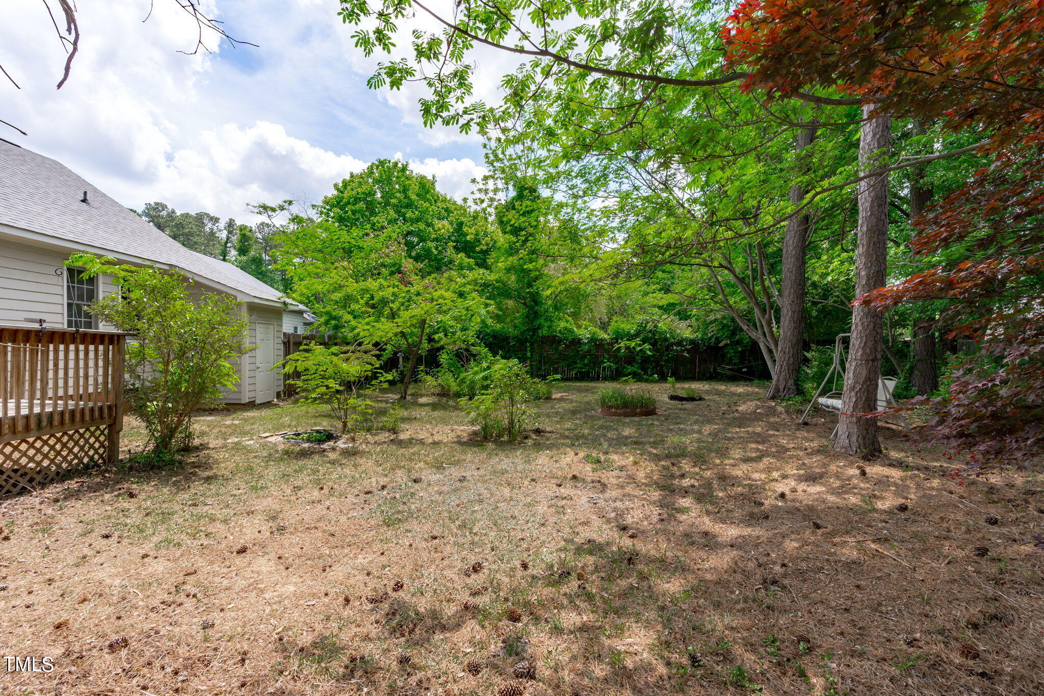 Undisclosed Address Garner, NC 27529 - Photo 29 of 31 a backyard of a house with lots of green space