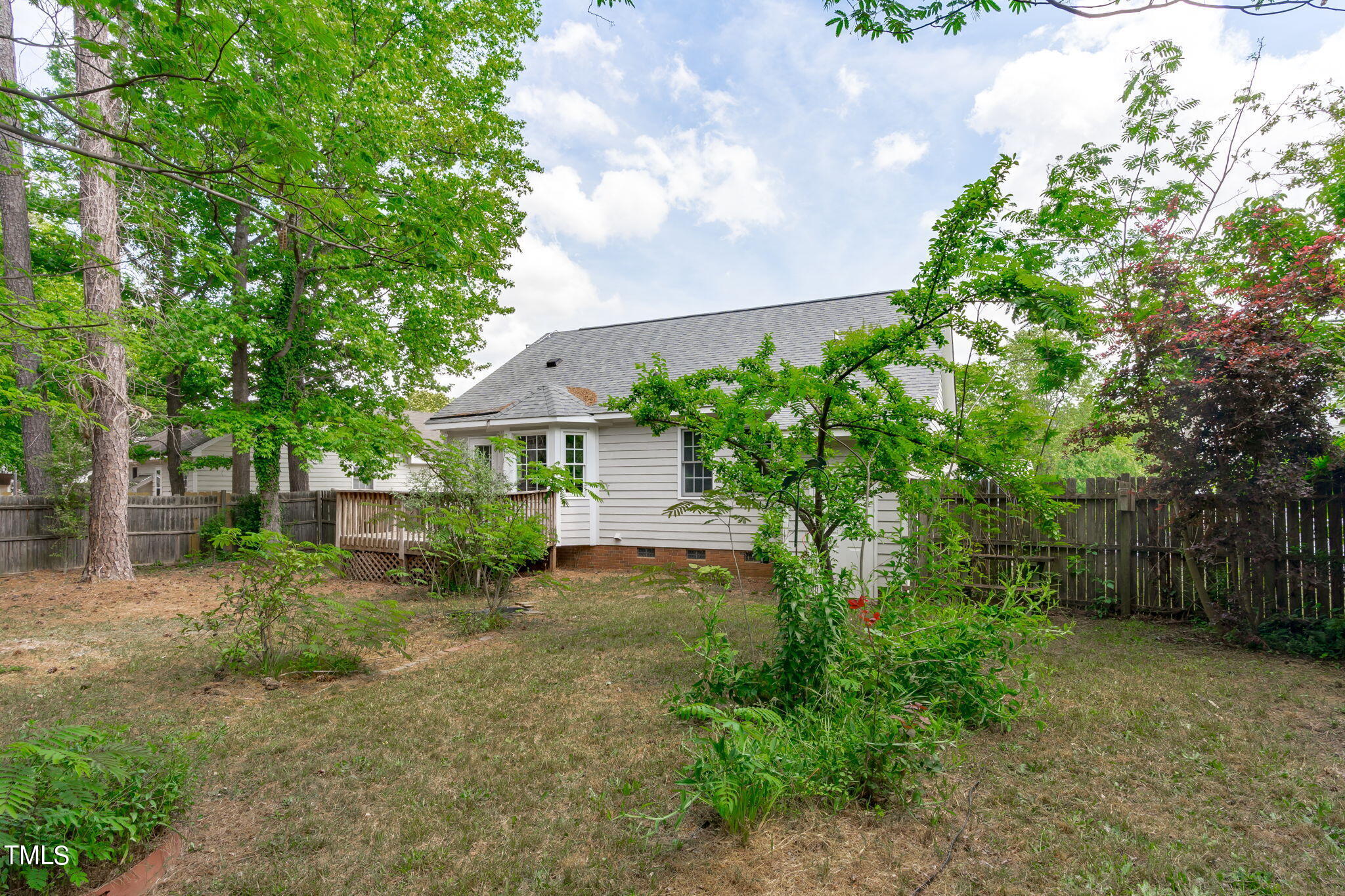 Undisclosed Address Garner, NC 27529 - Photo 30 of 31 a view of a house with a tree and plants