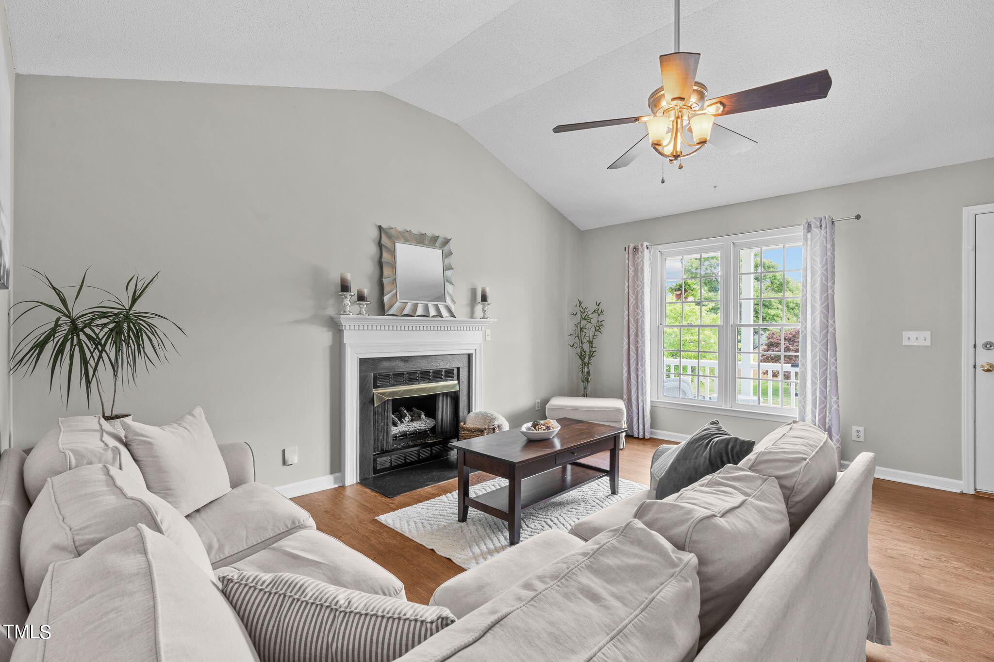 Undisclosed Address Garner, NC 27529 - Photo 5 of 31 a living room with furniture and a fireplace
