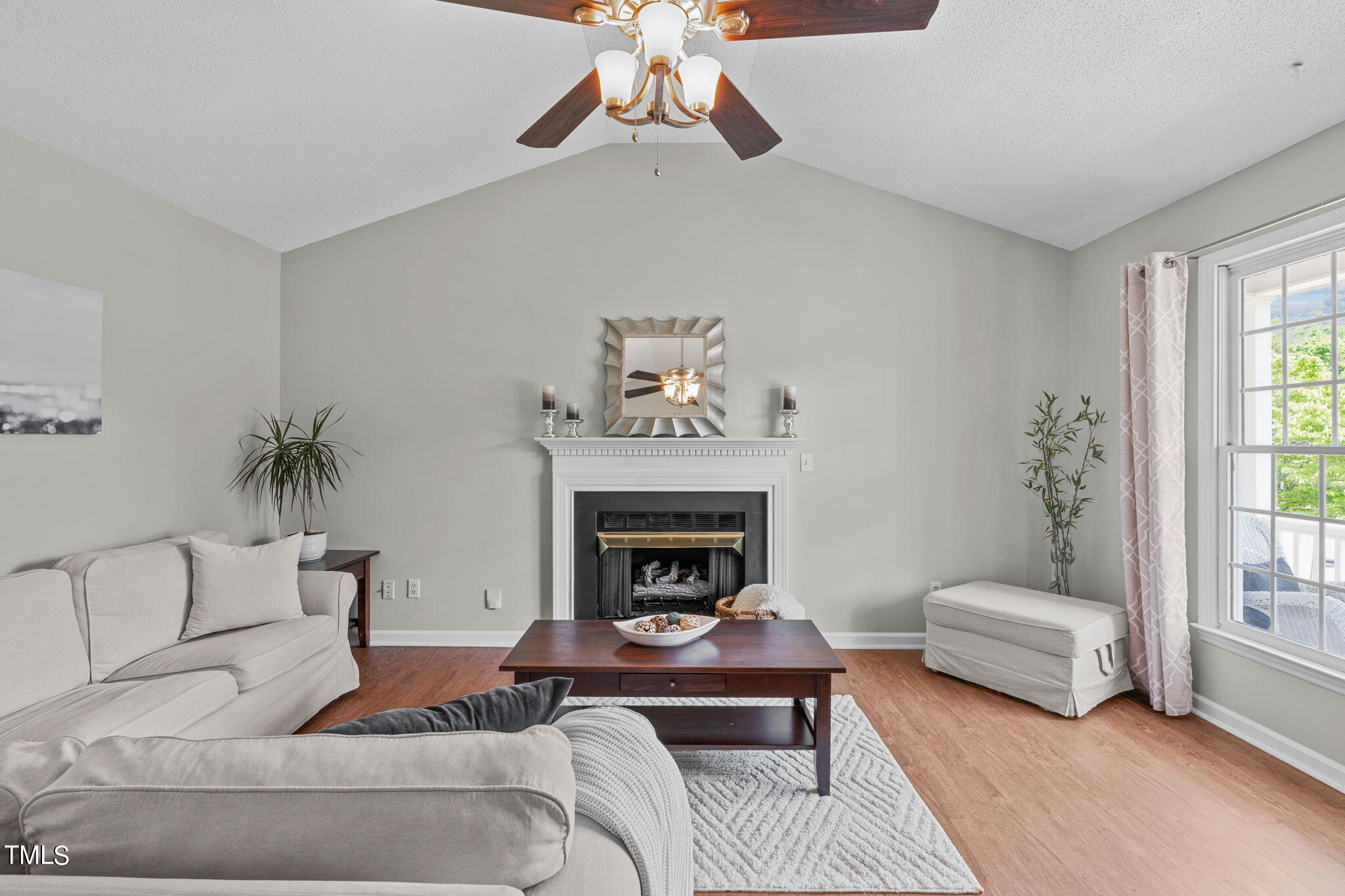 Undisclosed Address Garner, NC 27529 - Photo 8 of 31 a living room with furniture and a fireplace