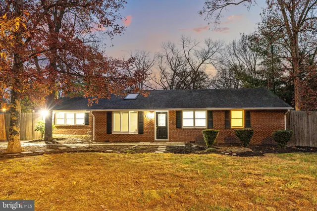 a view of a house with snow on the road