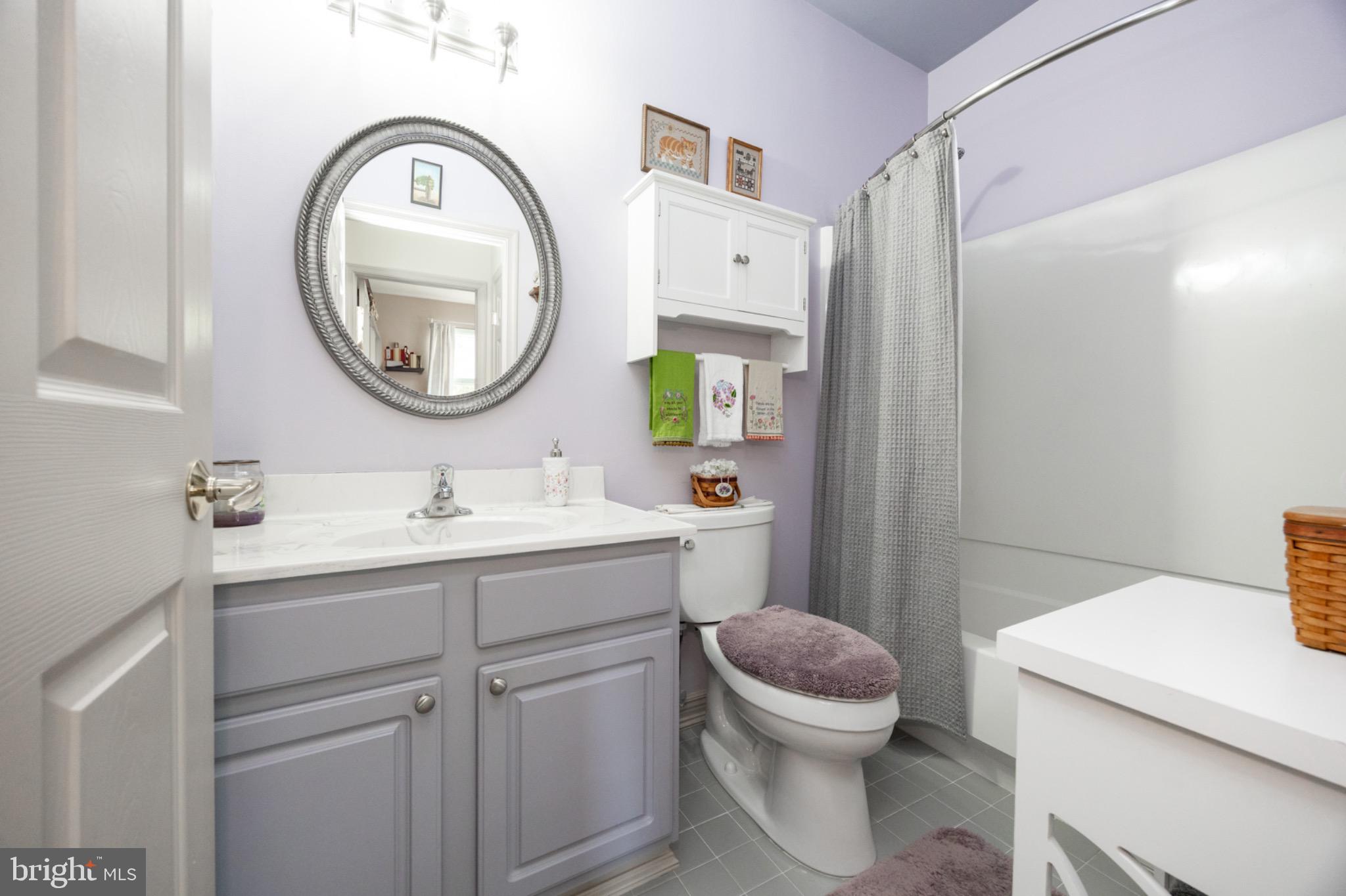 1701 Dawman Road Coatesville, PA 19320 - Photo 16 of 29 Charming bathroom with soft lavender hues.