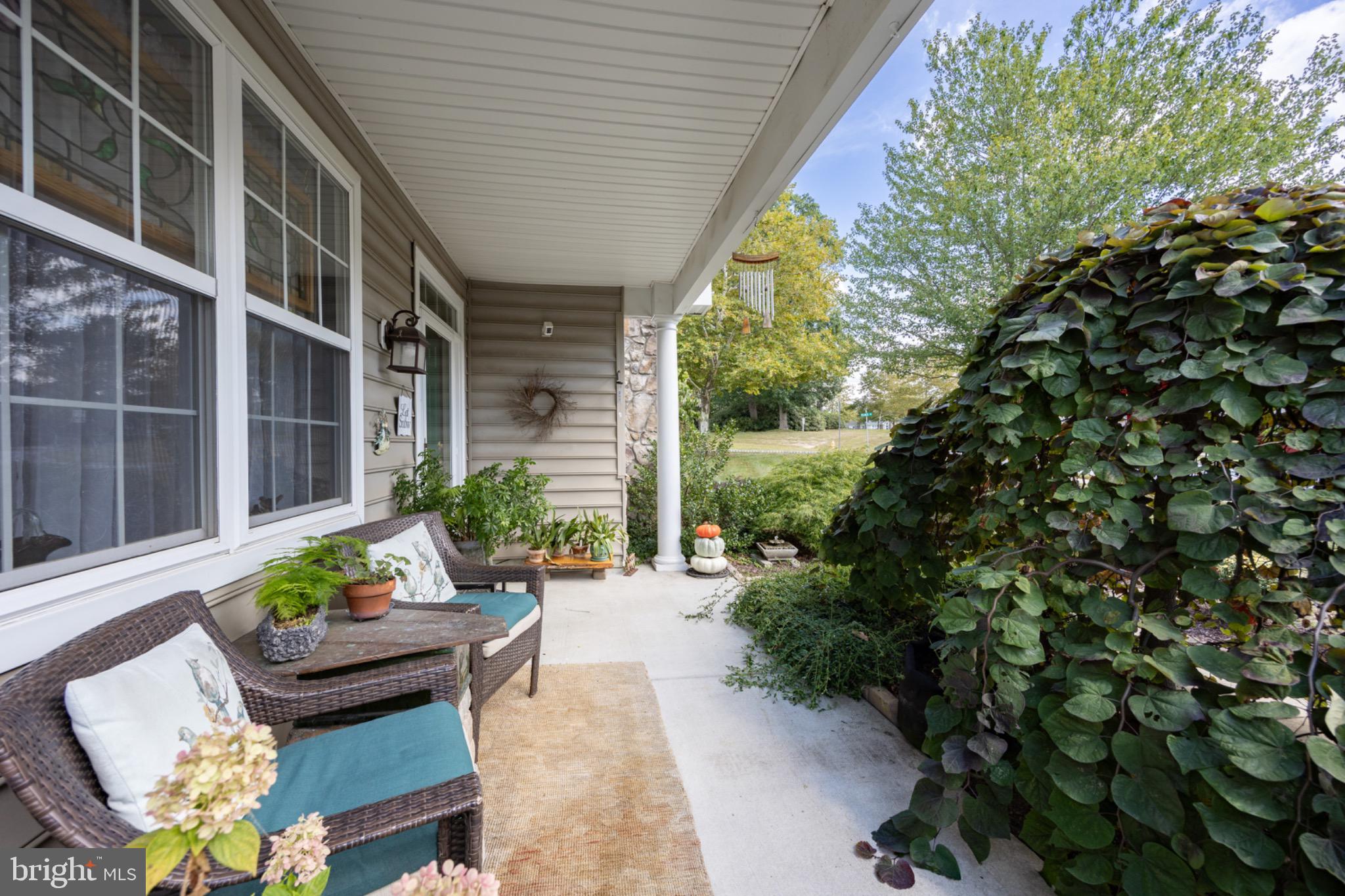 1701 Dawman Road Coatesville, PA 19320 - Photo 2 of 29 Charming porch with lush greenery.