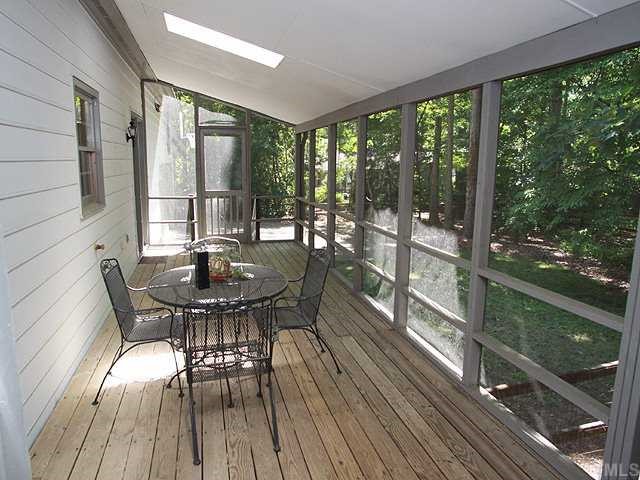 1432 Kildaire Farm Road Cary, NC 27511 - Photo 14 of 17 Wonderful screened porch across the back of the house provides opportunities for great outdoor living in all kinds of weather.