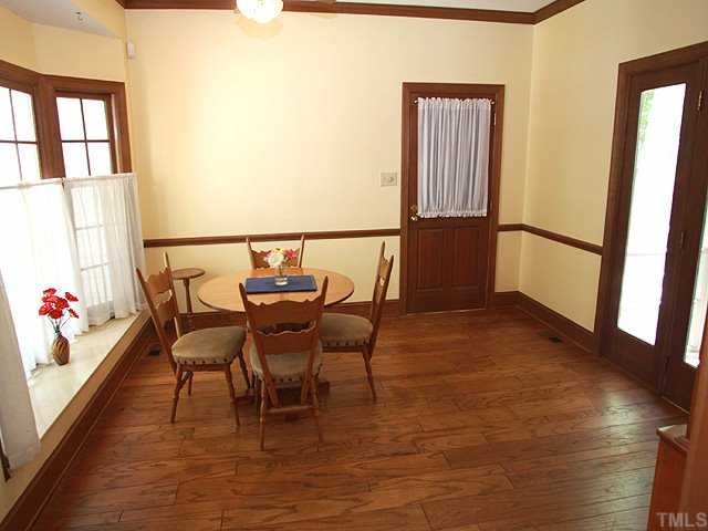 1432 Kildaire Farm Road Cary, NC 27511 - Photo 6 of 17 A bow window adds charm to this breakfast room with hardwood floors and doors to the deck.