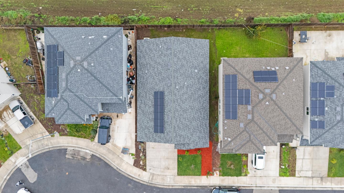 683 Granada Court Merced, CA 95341 - Photo 12 of 14 an aerial view of a house with a yard and lake view