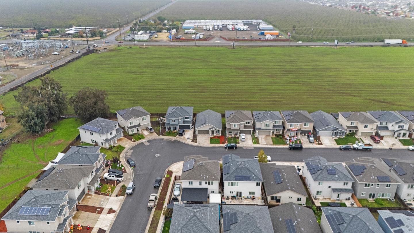 683 Granada Court Merced, CA 95341 - Photo 14 of 14 a view of building with ocean view