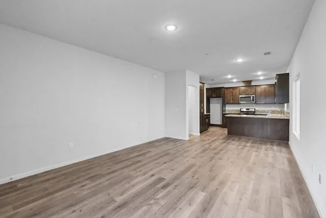 a view of kitchen with wooden floor