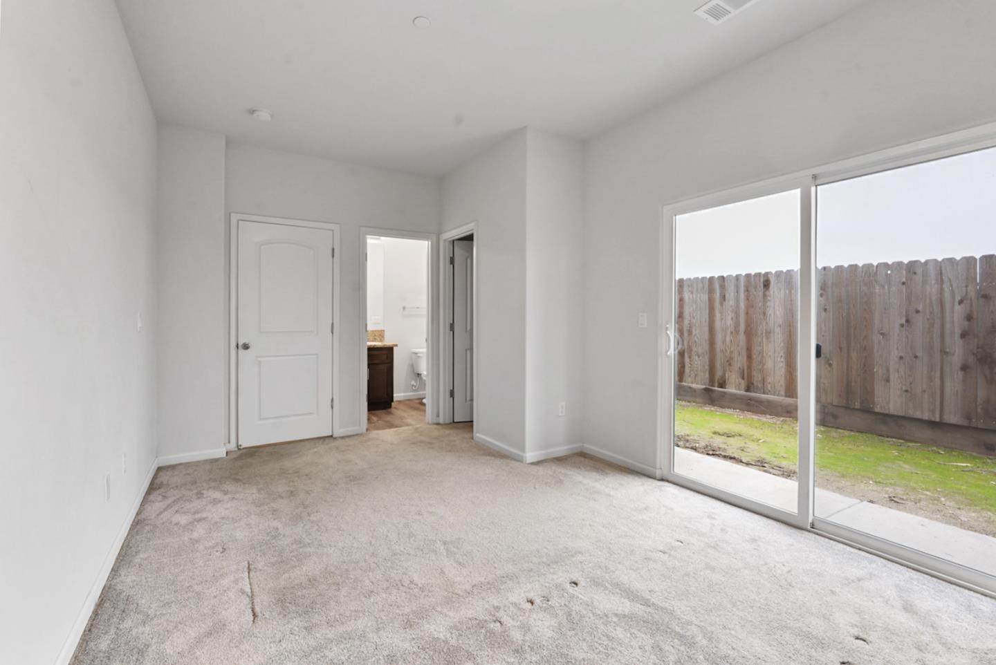 683 Granada Court Merced, CA 95341 - Photo 9 of 14 a view of an empty room with window
