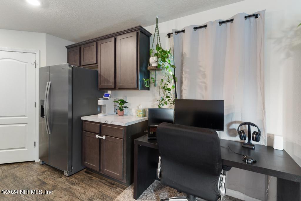 11291 Sheepshead Lane Jacksonville, FL 32226 - Photo 20 of 54 a kitchen with a refrigerator and a sink