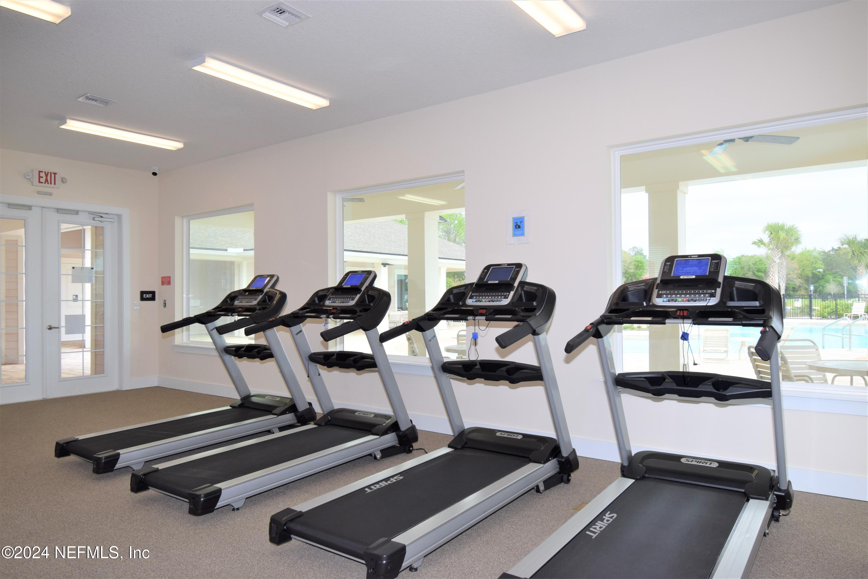 11291 Sheepshead Lane Jacksonville, FL 32226 - Photo 48 of 54 a room with gym equipment and a large window