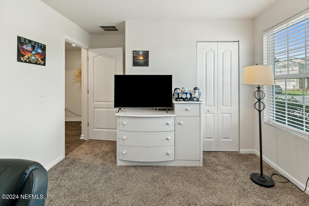 11291 Sheepshead Lane Jacksonville, FL 32226 - Photo 9 of 54 a view of room with flat screen tv