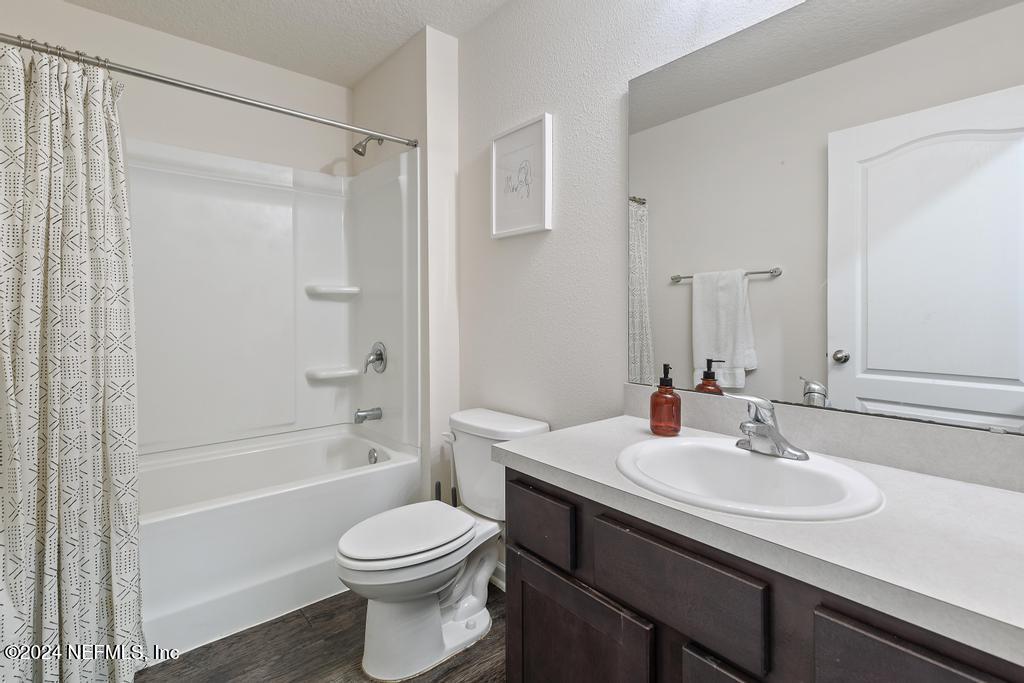 11291 Sheepshead Lane Jacksonville, FL 32226 - Photo 10 of 54 a bathroom with a sink toilet and shower
