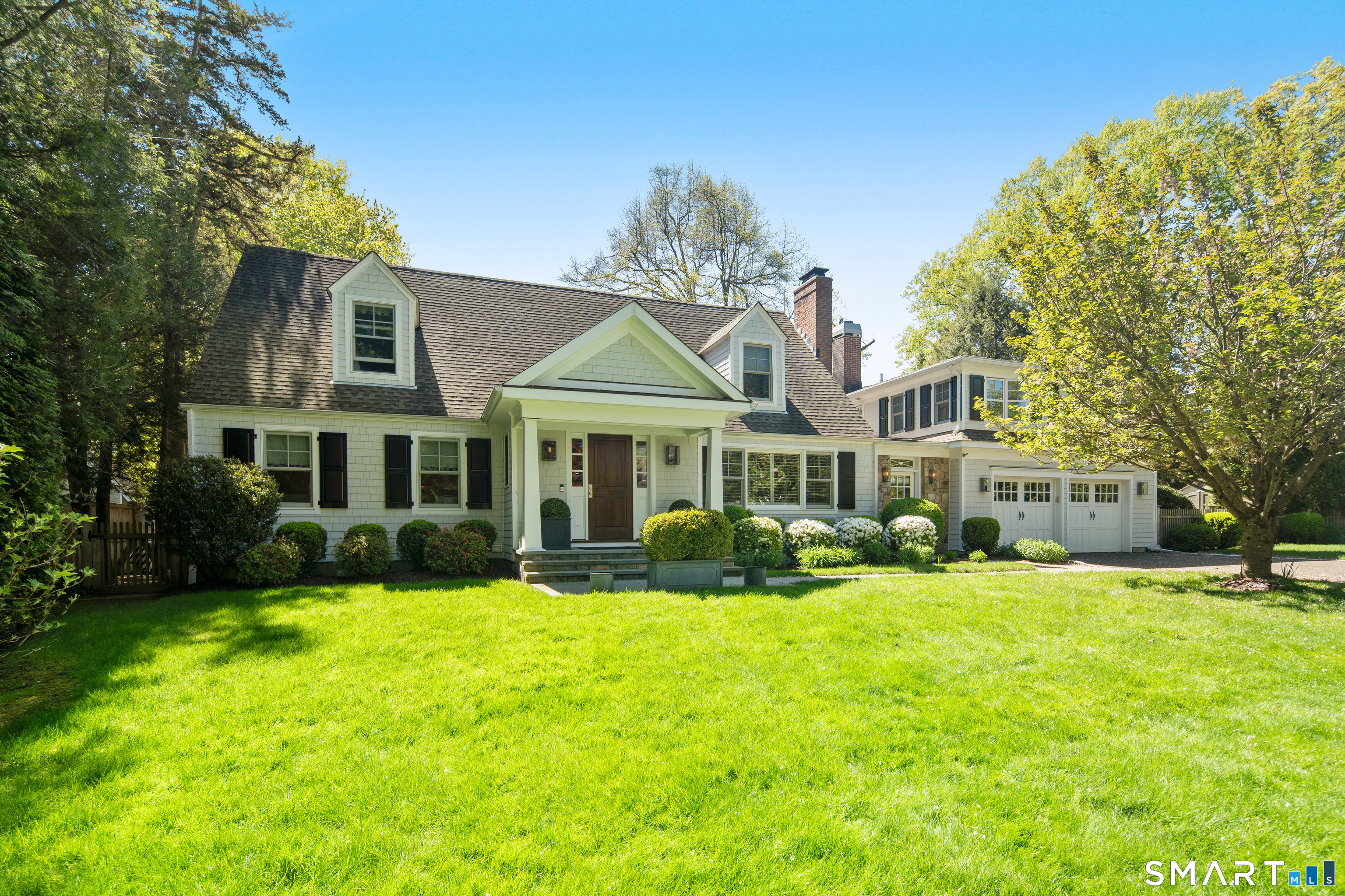 11 McLaren Road South Darien, CT 06820 - Photo 1 of 40 a front view of a house with a yard