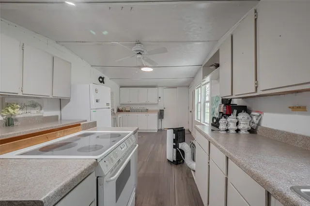 a kitchen with a sink cabinets and counter space