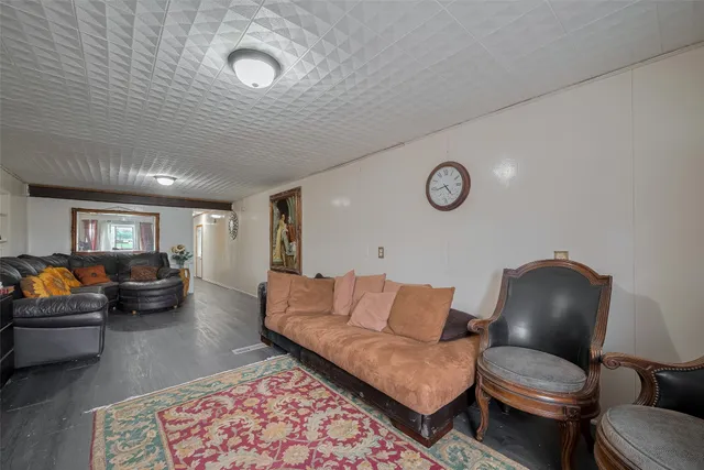 a living room with furniture and a rug