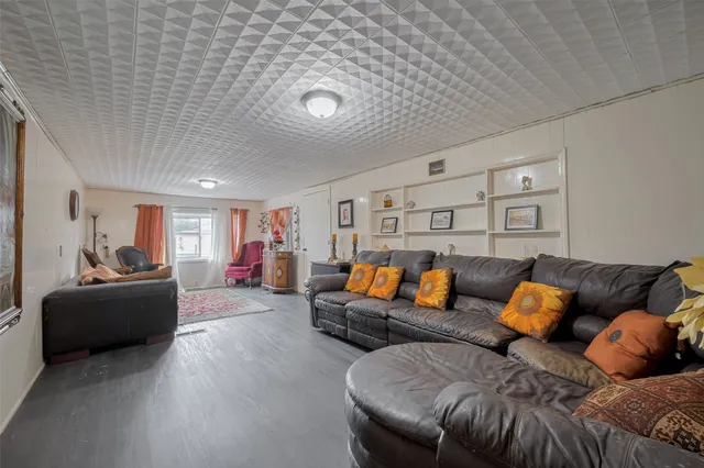 a living room with furniture and a couch