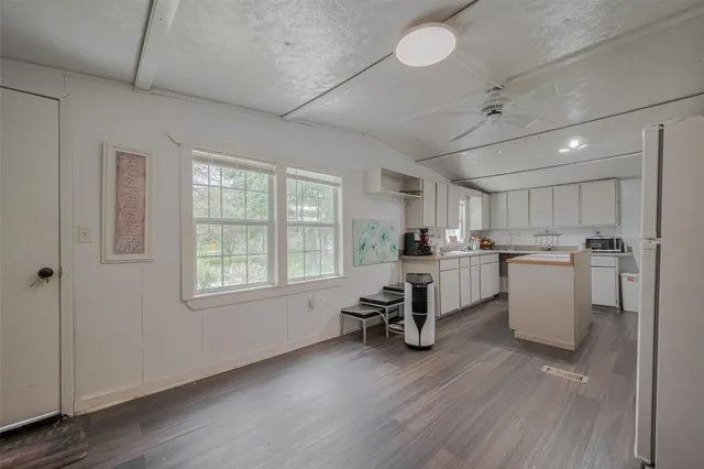 a view of a livingroom with furniture and windows