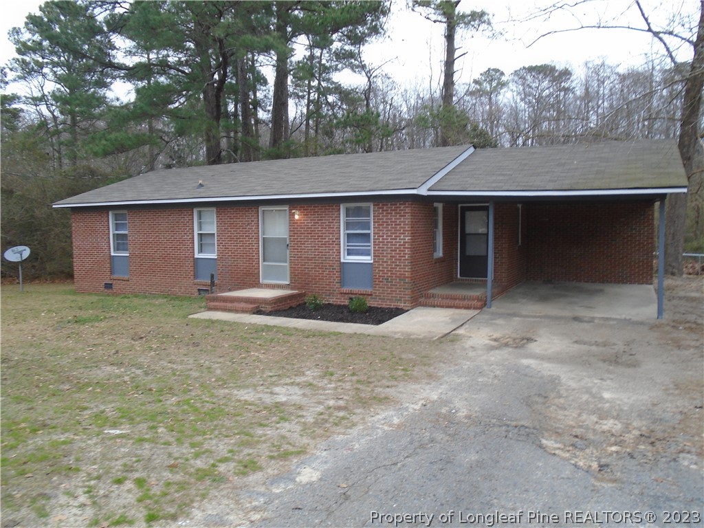front view of house with a yard