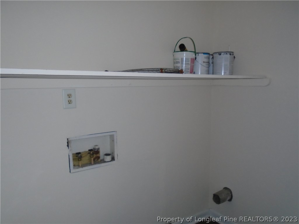5858 Columbine Road Fayetteville, NC 28306 - Photo 5 of 10 a bathroom with a sink and mirror