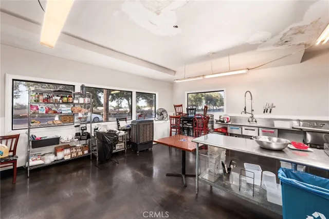 a room with gym equipment and a large window