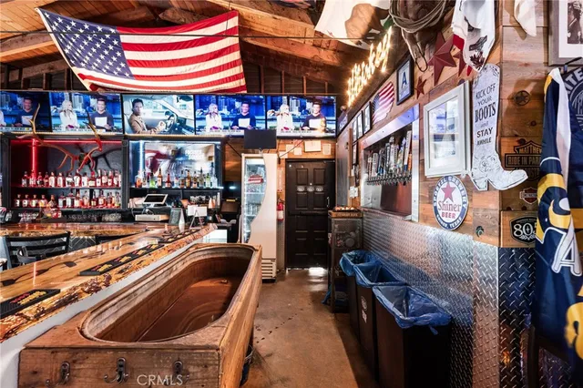 a view of a cafe with sitting area