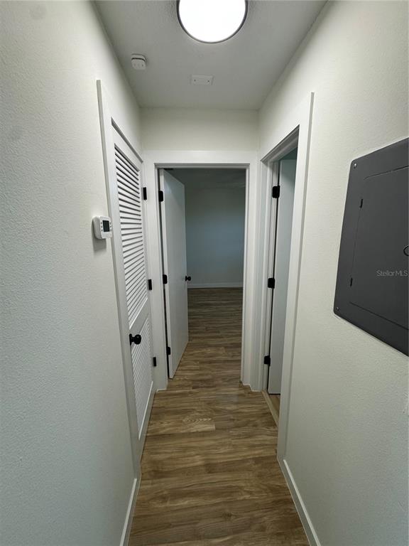 500 Vía Tripoli, Unit 3 Punta Gorda, FL 33950 - Photo 12 of 21 a view of a hallway with wooden floor and staircase