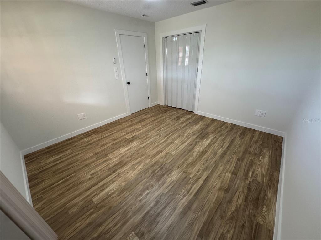 500 Vía Tripoli, Unit 3 Punta Gorda, FL 33950 - Photo 14 of 21 a view of empty room with wooden floor