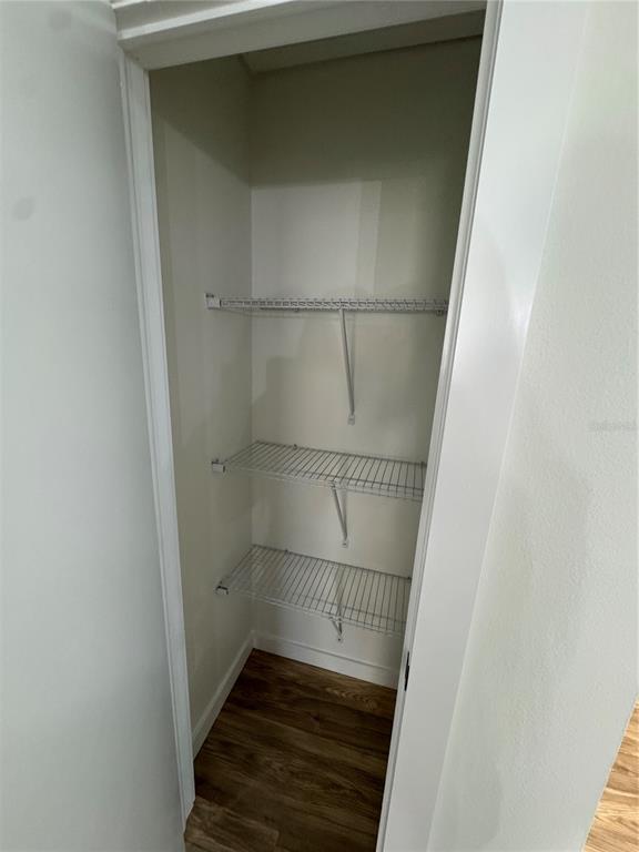 500 Vía Tripoli, Unit 3 Punta Gorda, FL 33950 - Photo 16 of 21 a walk in closet with wooden floor