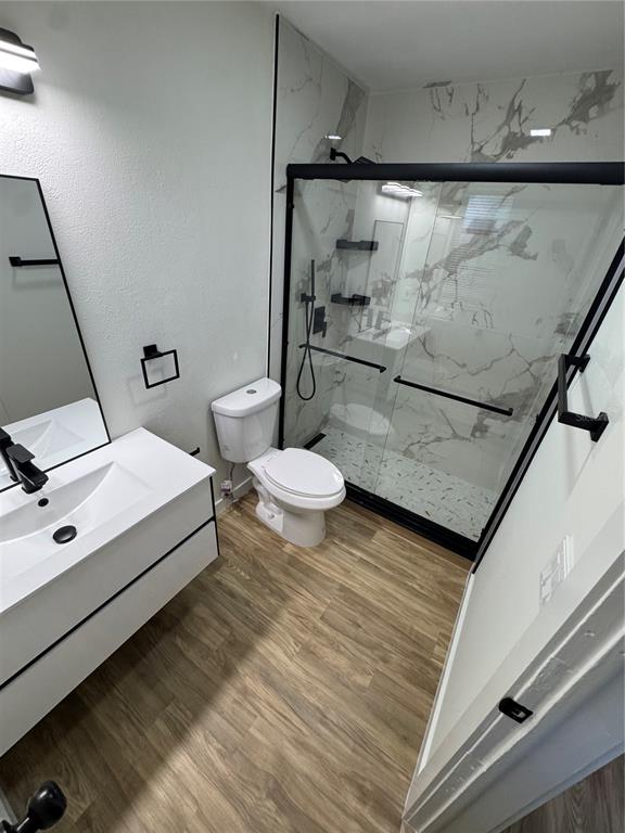 500 Vía Tripoli, Unit 3 Punta Gorda, FL 33950 - Photo 20 of 21 a bathroom with a sink mirror vanity and toilet