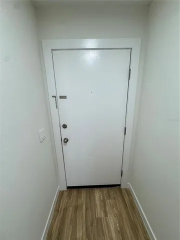 a view of room with hardwood floor