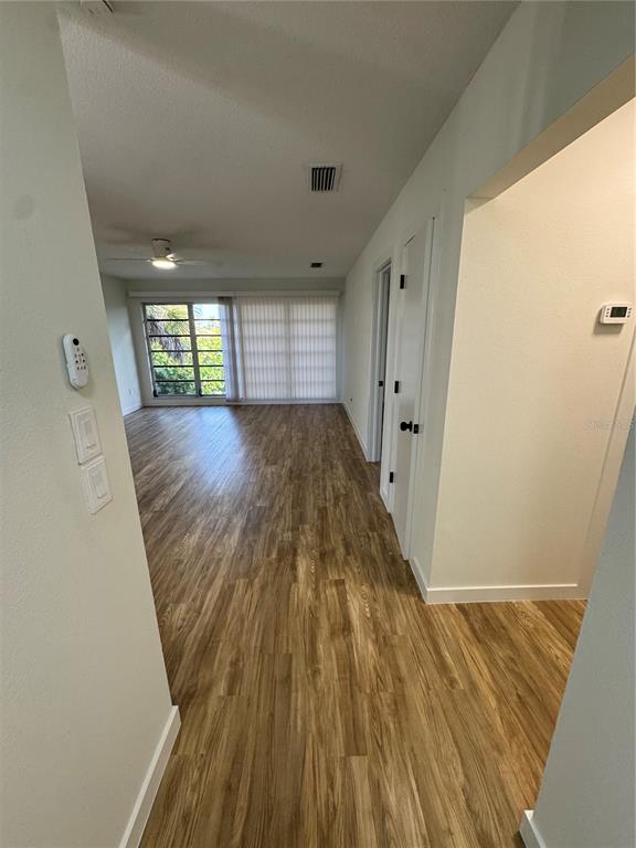 500 Vía Tripoli, Unit 3 Punta Gorda, FL 33950 - Photo 8 of 21 wooden floor in a hall with an entryway