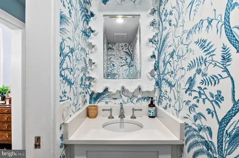 a bathroom with a sink and a mirror