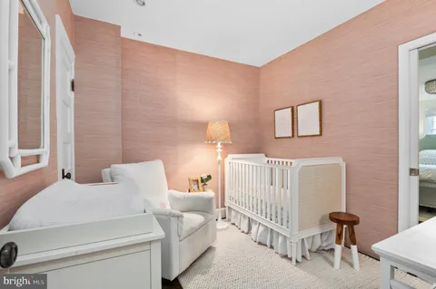 a bedroom with a bed and a lamp with window