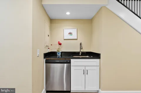 a kitchen with a sink and cabinets