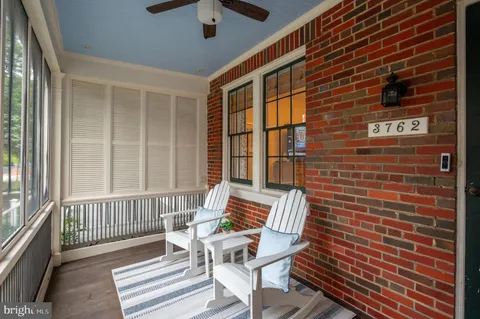 a view of a patio with a table and chairs