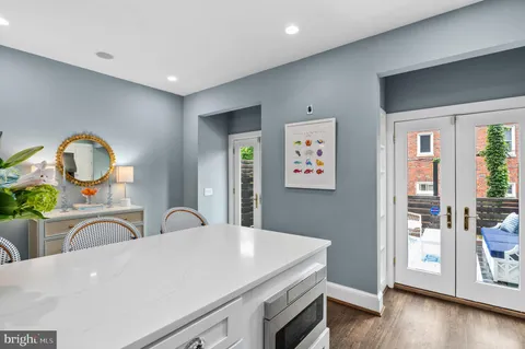 a view of living room with furniture and wooden floor