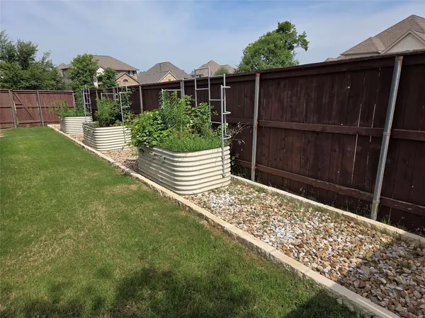 a front view of house with wooden fence