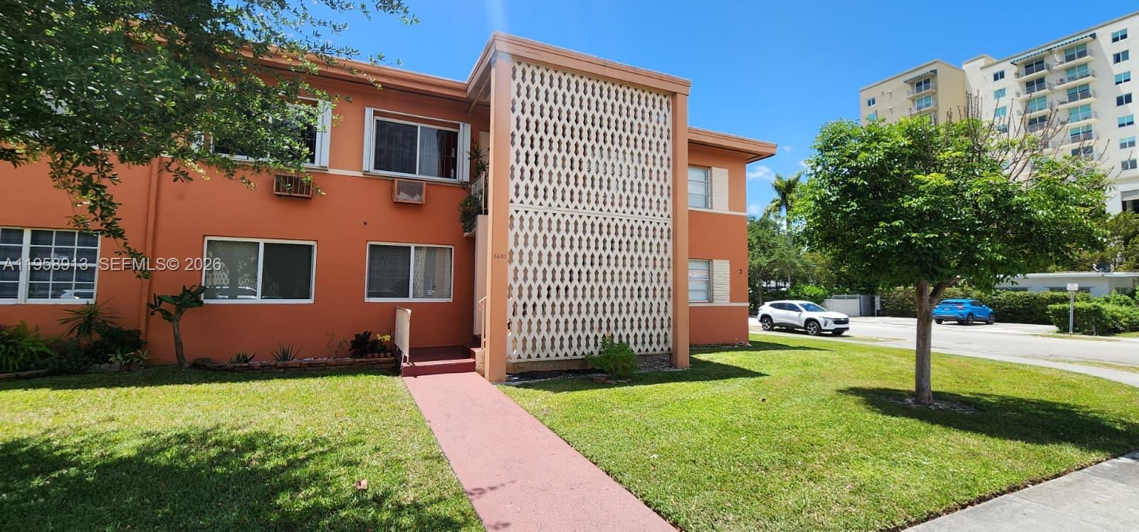 3670 Southwest 10th Street, Unit 10B Miami, FL 33135 - Photo 12 of 14 a front view of a house with garden