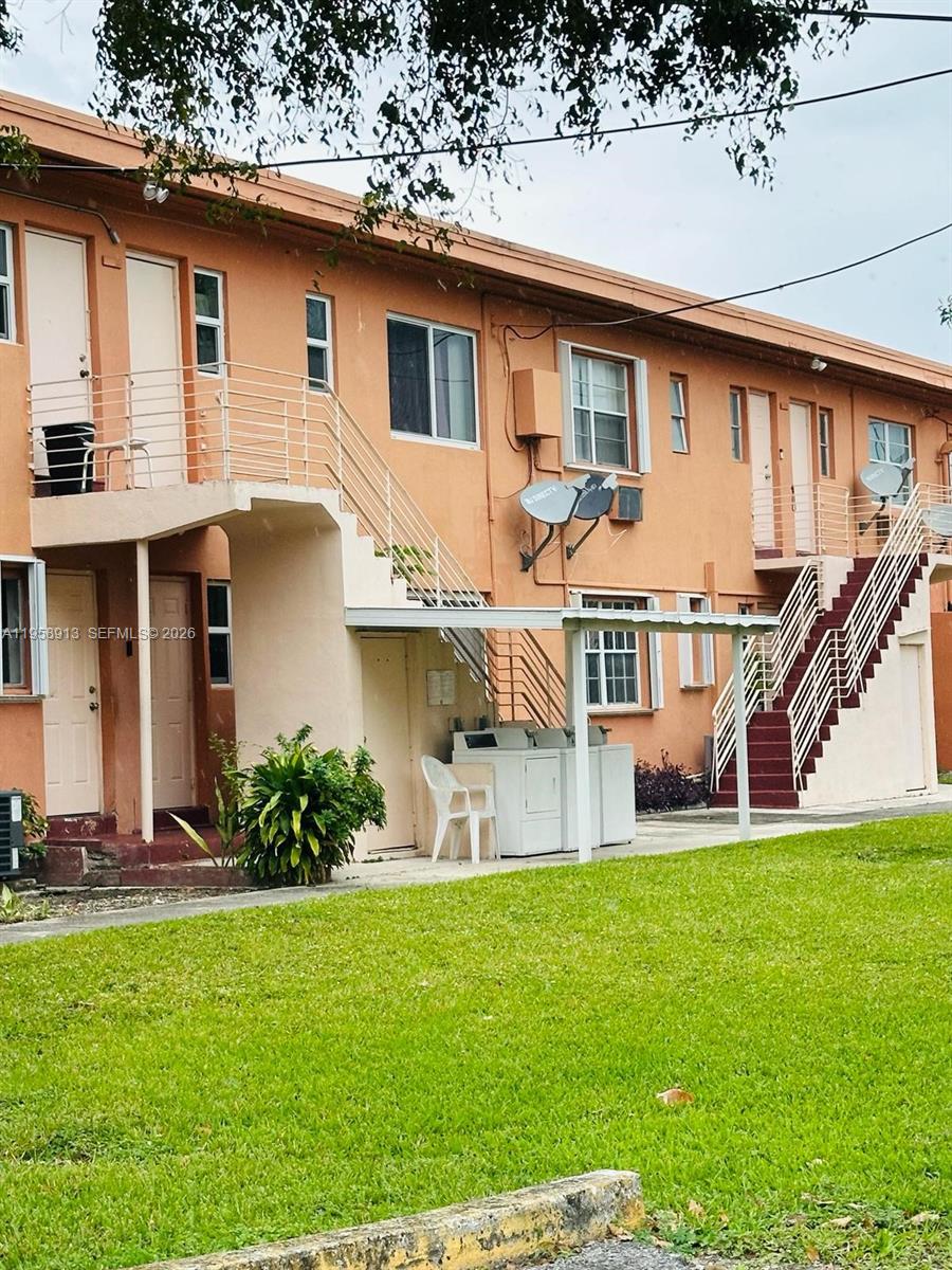 3670 Southwest 10th Street, Unit 10B Miami, FL 33135 - Photo 12 of 12 a front view of house with yard and green space